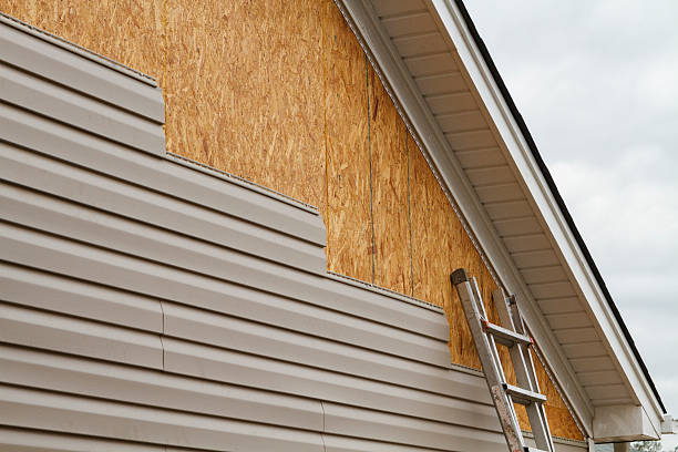 Professional Siding technician working in High Point, FL
